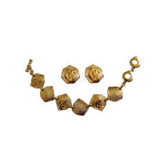 YVES SAINT LAURENT 'YSL' gilt earrings & bracelet