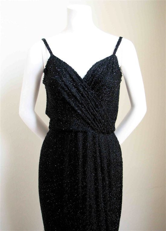 Very rare, gorgeous black bugle beaded gown from Ceil Chapman. Ca. 1960. Zips up back. US size 2/4. Very good condition. Some light fraying at back side of straps and underside of hemline and missing beads.