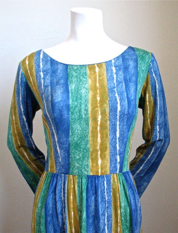 Beautiful abstract patterned silk jersey dress from Pucci dating to the 1960's. The colors are very vibrant and include kelly green, azure blue and marigold. Fabric is signed 'PUCCI' in numerous places. Best fits a US 6 to 10. Bust measures