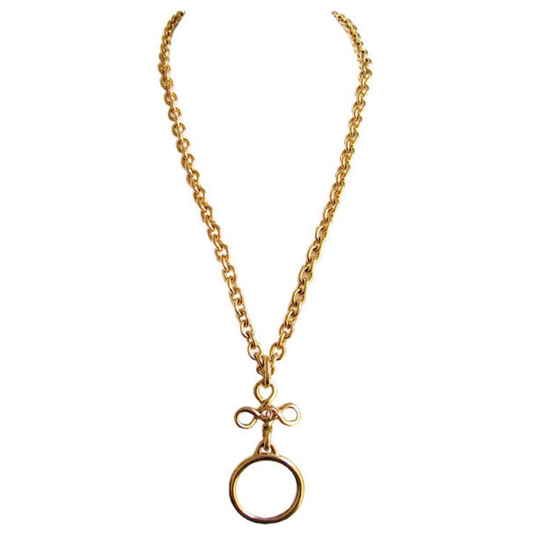 CHANEL extra long gold necklace with magnifying glass pendant