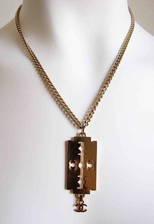gold razor blade pendant