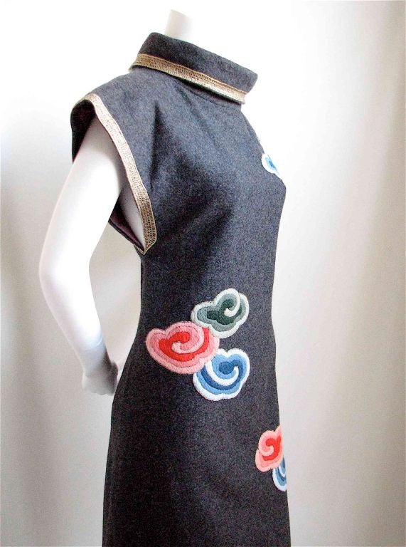 Stunning charcoal wool dress with vivid embroidery and ornate gold trim made by Karl Lagerfeld for Chloe circa 1970's. Coral, blue, green and gold on a charcoal background.  Very intricate details. Sexy low cut arm holes. Stand up neckline. Hidden