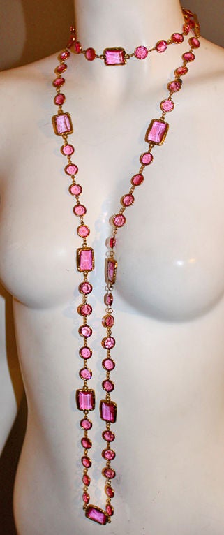 This dazzling necklace hails from CHANEL’s 1981 collection. This much-coveted “Chicklet” necklace is composed of pink faceted crystals set in textured gold-tone metal. Metal hang tag stamped “Chanel – CC logo – 1981”. <br />
<br />
Measurements: