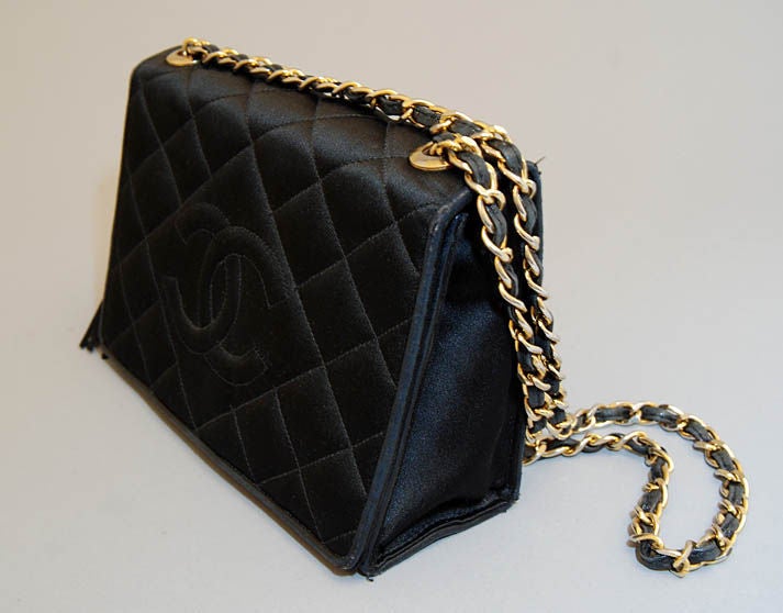Women's CHANEL Black Quilted Satin CC Logo Tassel Flap Bag