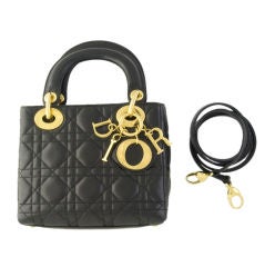 Dior   small Lady Dior black quilted lambskin with Dior letters.