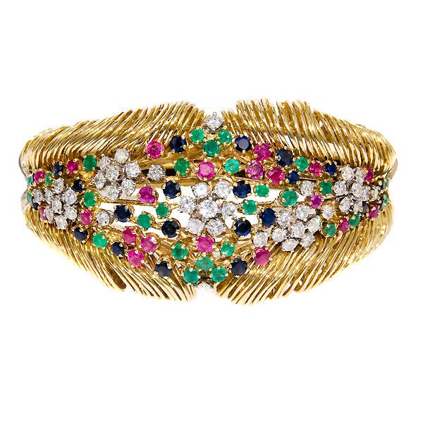 Colorful 1960's 18K yellow gold hinged bracelet signed by Van Gogh, cast and hand worked gold wire, set with Diamonds Rubies, Emeralds and Sapphires. Medium wrist size