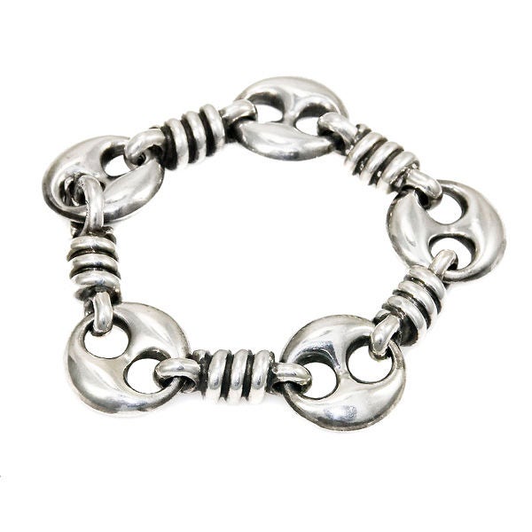 Heavy Sterling silver Bracelet by Gucci with alternating Coiled Links and Trade Mark Gucci links with Green Guilloche Enamel.
