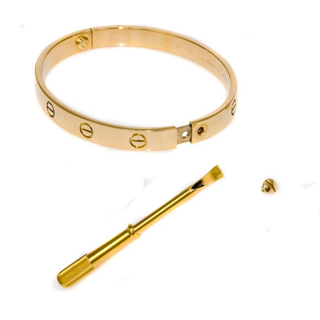 Classic Cartier 18K Yellow Gold Love Bracelet, Signed and Numbered, size 19, with original Screwdriver.