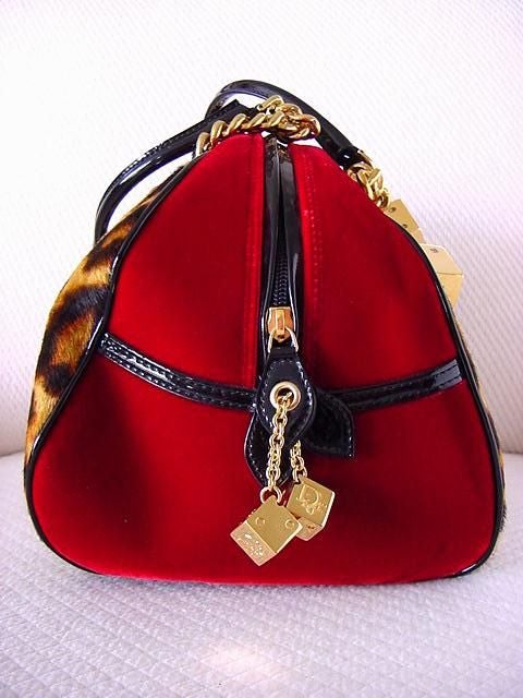 VEGAS BABY!!! CHRISTIAN DIOR Runway bag from Fall 2004 Collection... ALMOST IMPOSSIBLE TO GET EVEN IF YOU WERE ON THE LIST~ <br />
This GAMBLER Handbag is the ultimate collectors bag in leopard print pony and ruby red velvet with black patent trim.