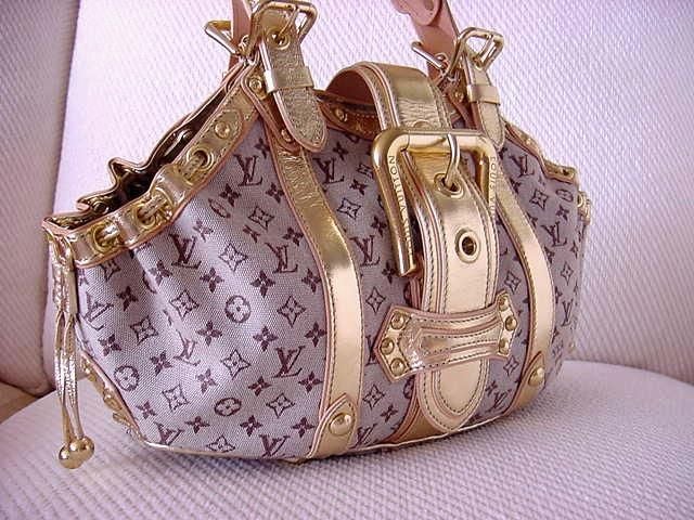 The wildly collectable treasure from LOUIS VUITTON. <br />
Theda GM Mono Mini - and wow - the Gold leather trim and details is all about ultimate glam. <br />
Cotton canvas body with the classic LV logo. <br />
The colour is a soft mauve plum -