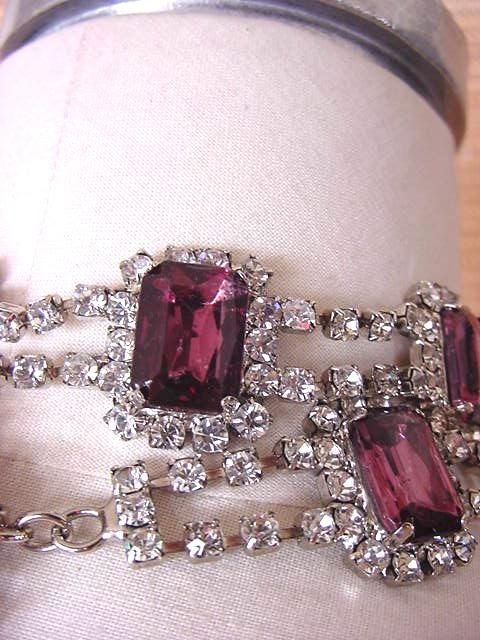 Wow!  Fabulous jeweled DOLCE&GABBANA belt of Swarovski clear diamante Crystals. <br />
Beautiful emerald cut large 'Amethyst' coloured stones are spaced through out - the effect is striking! <br />
The belt has a chain drop with an amethyst and