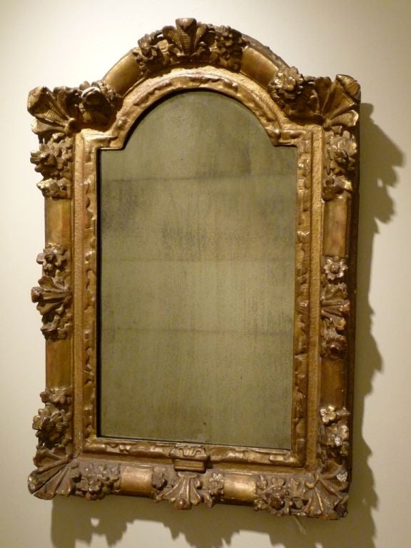 18th century giltwood mirror with original glass.