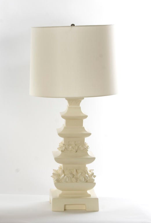 SINGLE AVAILABLE<br />
+ A pagoda lamp that is straight out of a Tony Duquette interior<br />
+ Amazing detail work on this multi-tiered vessel<br />
+ Ceramic body has been newly refinished in a cream satin paint<br />
+ Two bottom tiers are