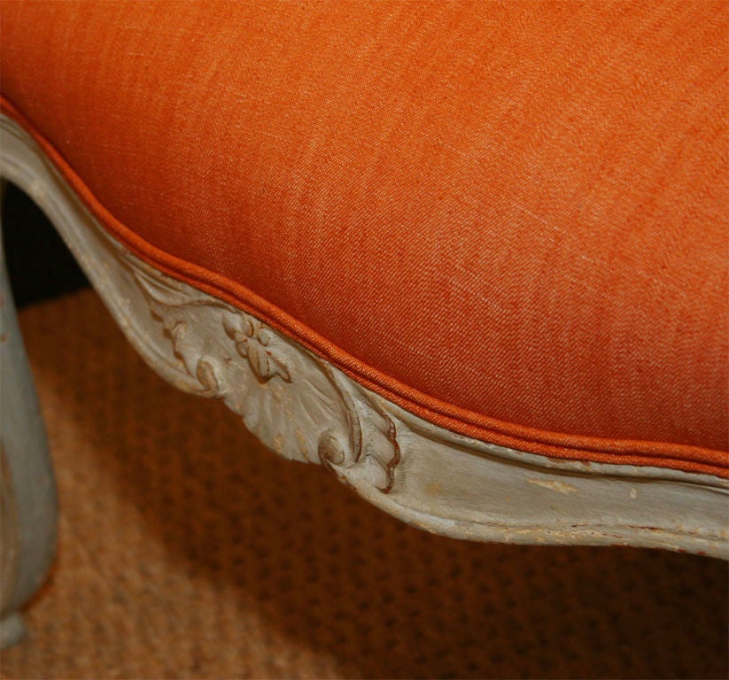 Wood Painted French bergeres with orange upholstery