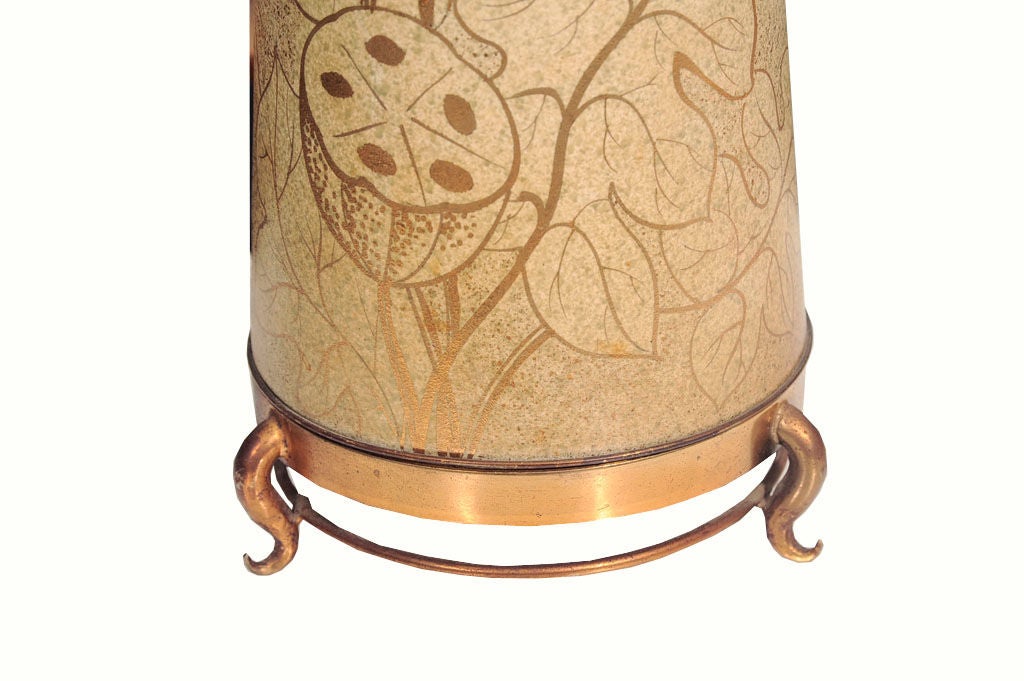 1960s decorative ceramic table lamp with floral motif on brass footed base. Rewired with newly added paper shade.