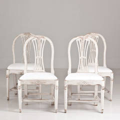 A Set of Four Swedish Wheatsheaf Dining Chairs
