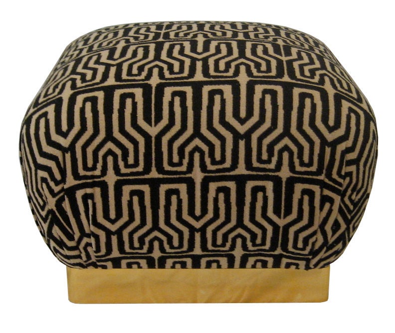 Large Pair of Poufs on Brass clad bases with woven Kuba pattern upholstery.