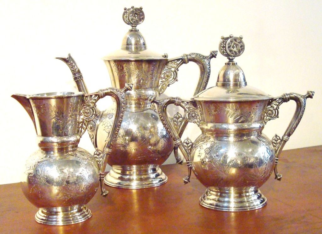 19THC QUADRIPLE SILVER PLATED / THREE PIECE TEA SET,SIGNED MERIDEN SILVER CO./PRISTINE CONDITION AND NO WEAR TO THE SILVER PLATING AND NO DENTS.THIS IS IN REMARKABLE CONDITION AND IS VERY RARE TO FIND.COFFEE POT,SUGAR AND CREAMER.SOLD ONLY AS A SET