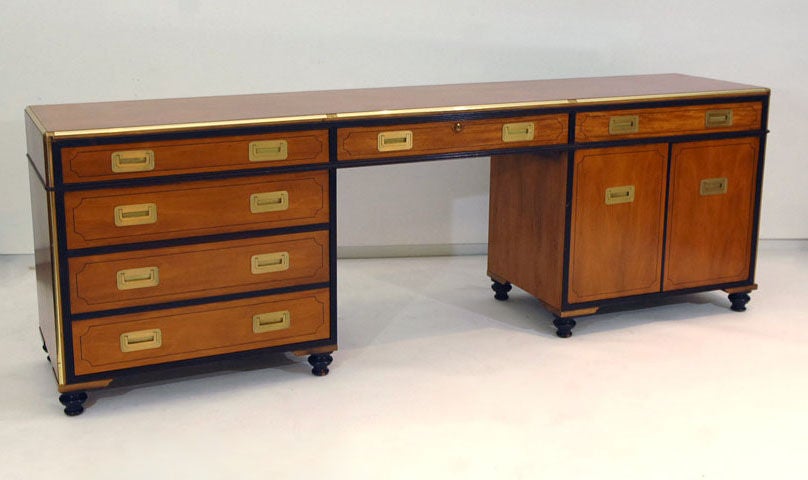 Absolutely stunning gold label baker campaign style credenza from the Far East collection. This was the top of the line for Baker and is extremely well made. It was part of the collector's edition set that included a double sided desk with leather