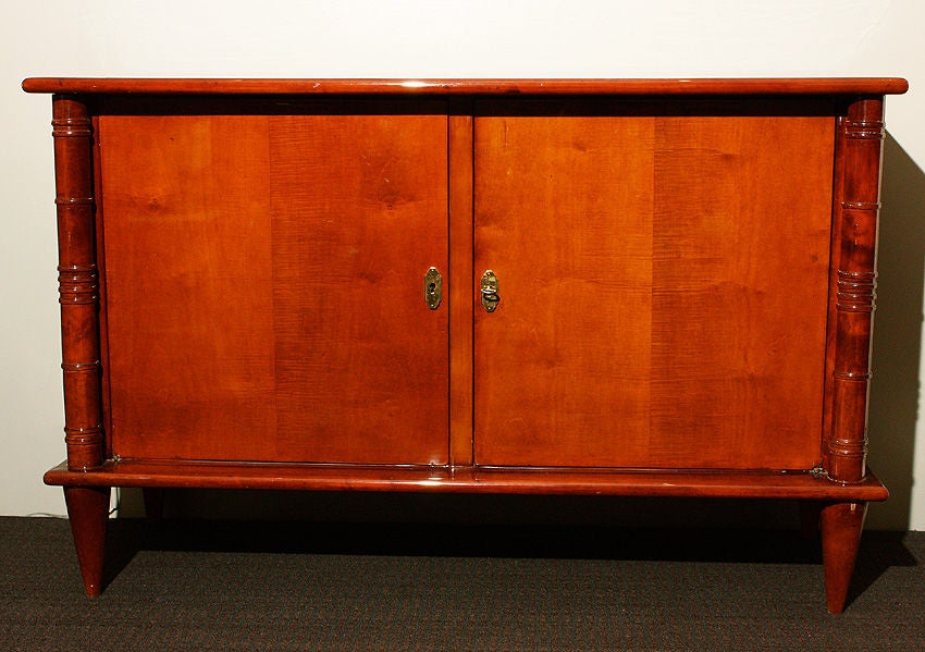 Maurice & Leon JALLOT <br />
Sycamore 1930 Art Deco Commode with 2 doors. <br />
2 grooved column on caster socket cone-shaped feet. <br />
<br />
H : 33