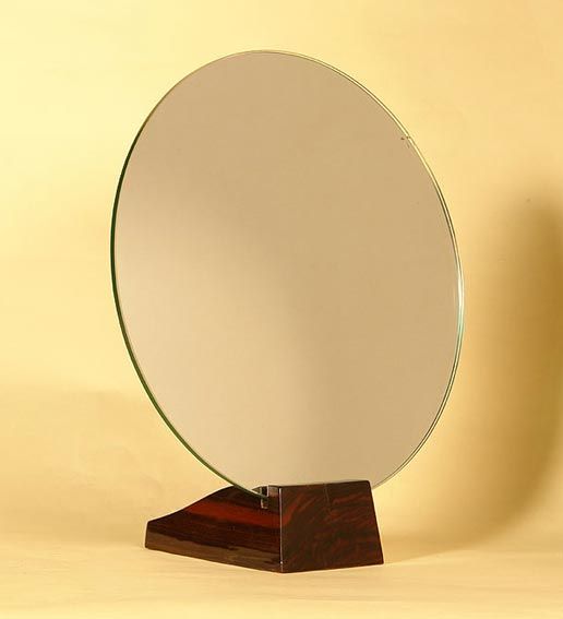 Emile-Jacques Ruhlmann (1879-1933)

Mirror in solid macassar ebony with a round glass.
Signed underneath and stamped 