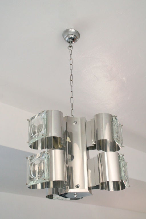 Italian murano glass and steel chandelier, made in Italy, c. 1970's. Thick murano glass squares attach onto steel square frames, with inner lights.


(Key: Mazzega, Sputnik, Panton, Venini, ceiling light)