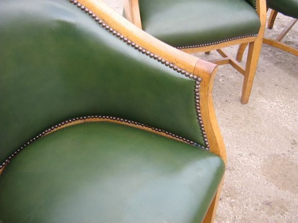 Green leather upholstered oak frame chairs. Sold as a set of 6.