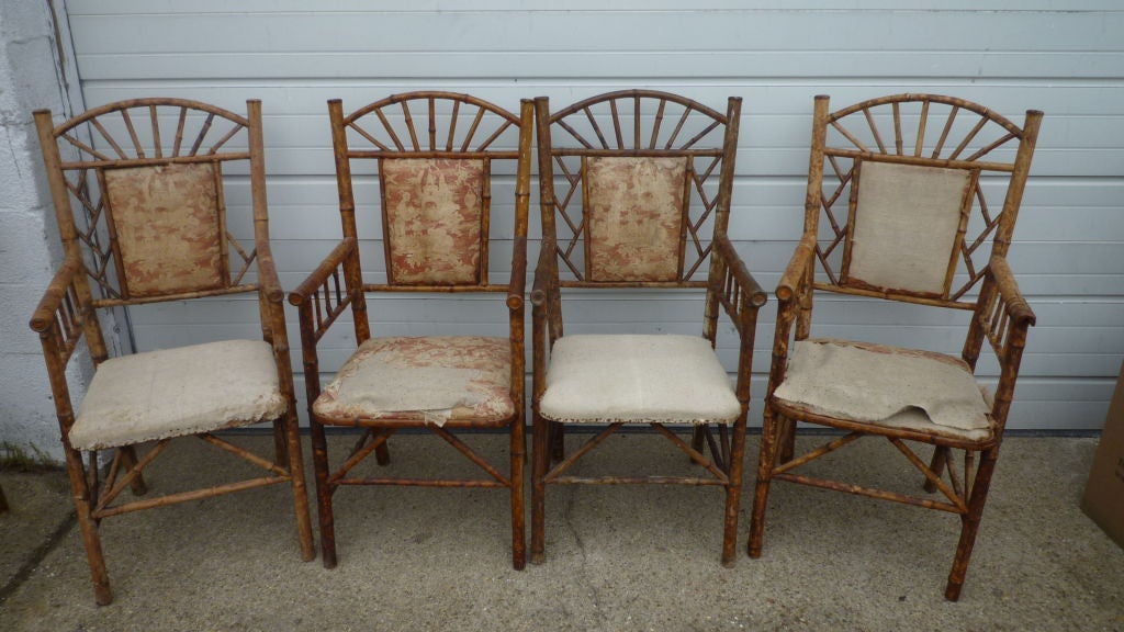 A set of four unusual early 20th C French Bamboo chairs in original fabric.
