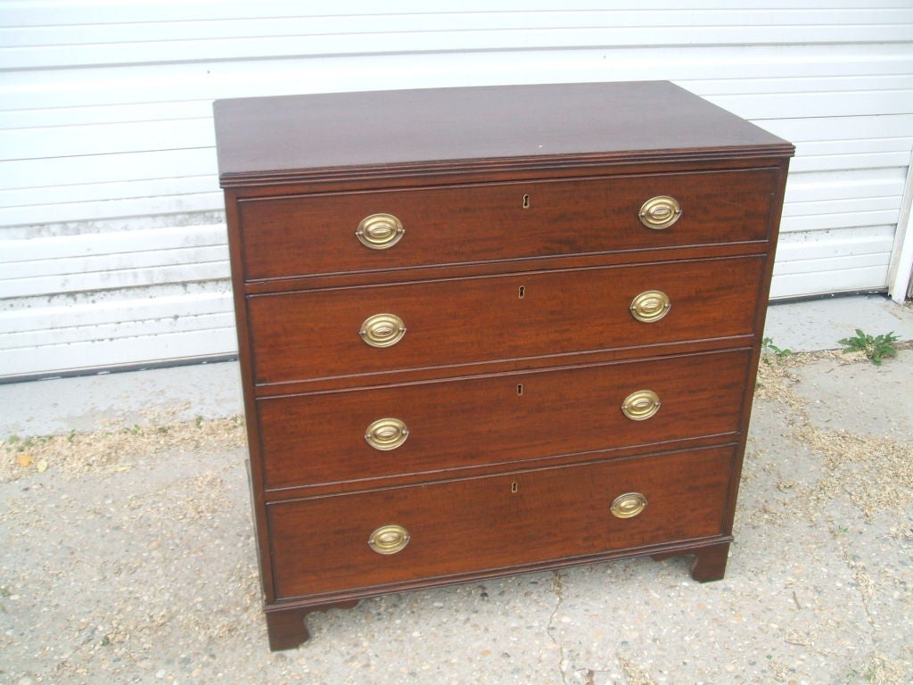 Mahogany chest with reproduction brass handles added later.<br />
We have over 30 different Mahogany and Oak Chest of Drawers in stock, and pairs of reproductions.