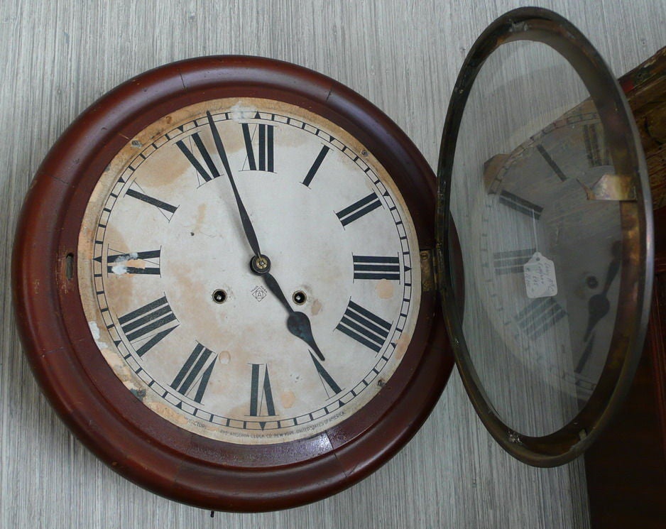 Wood Ansonia Schoolhouse clock, Brass trim around glass,<br />
Chimes on hour and half hour. Runs