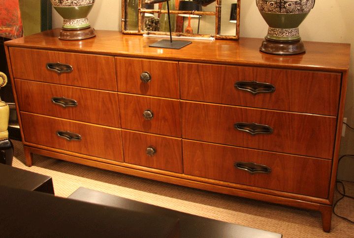Walnut chest of drawers with brass hardware <br />
by Henredon