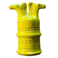 Yellow glazed ceramic pot with two horse heads