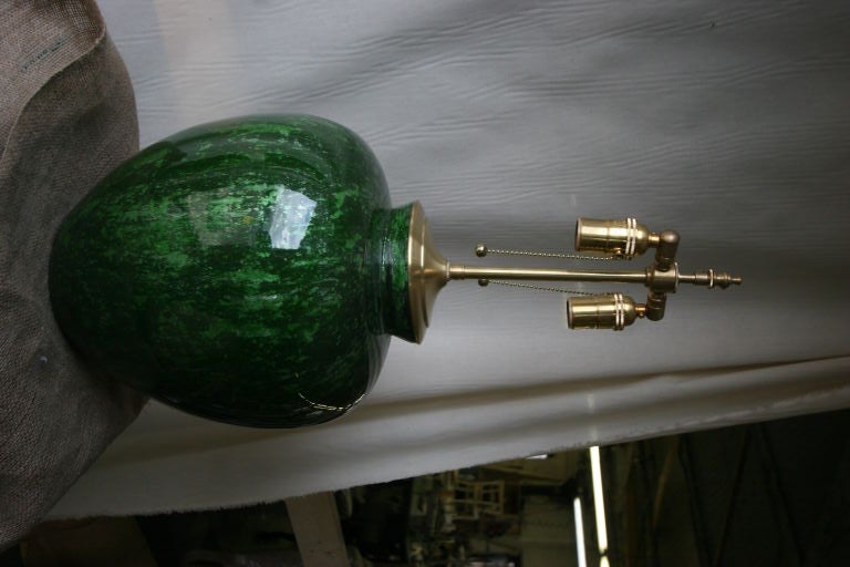 Pair of 1970's glazed eglomise style orbits