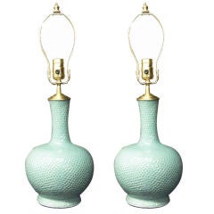 Pair of celadon green hand glazed Jars with lamp application.