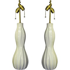 Pair of elegant white  glazed  vessels with lamps application.