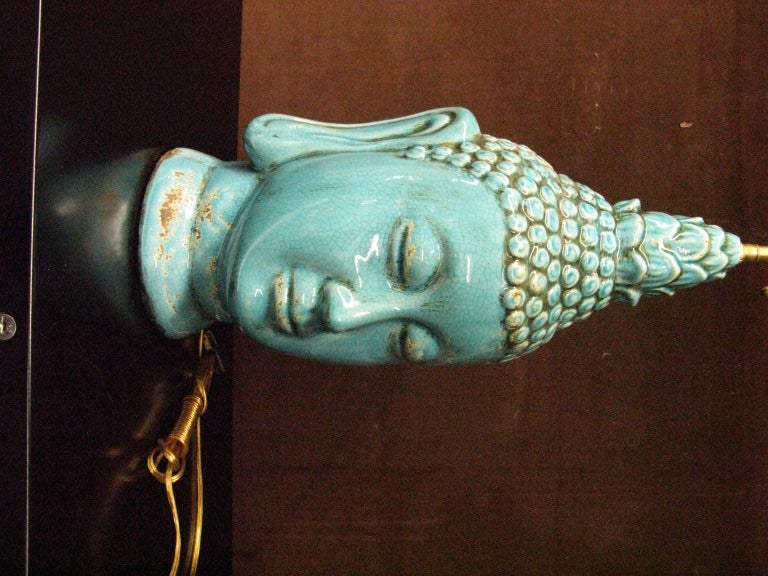 20th Century Pair  of glazed ceramic  buddha heads .