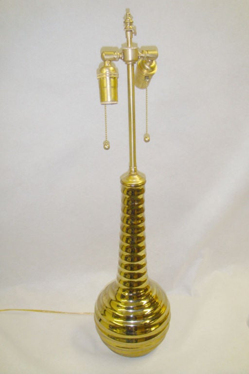 Pair of Mid century modern  gold glass vases with lamp application.  The brushed Brass post hold dual sockets with individual pull chains.  The shade platform can be extended another 3 