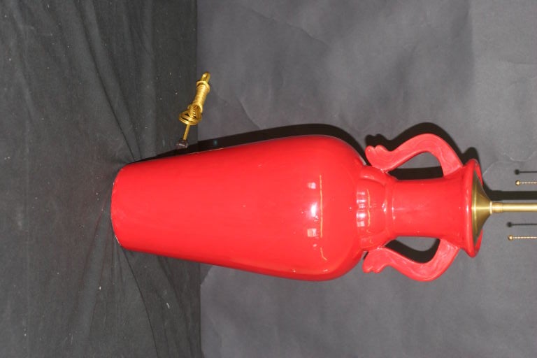 Pair of 1960's Red vases with lamp application. The newly wired lamps come with dual, individually controlled sockets and can accommodate up to 100 watts each. Measures: The vases are 19.5