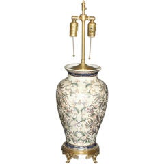 An English ceramic hand painted Table lamp with a brass base.