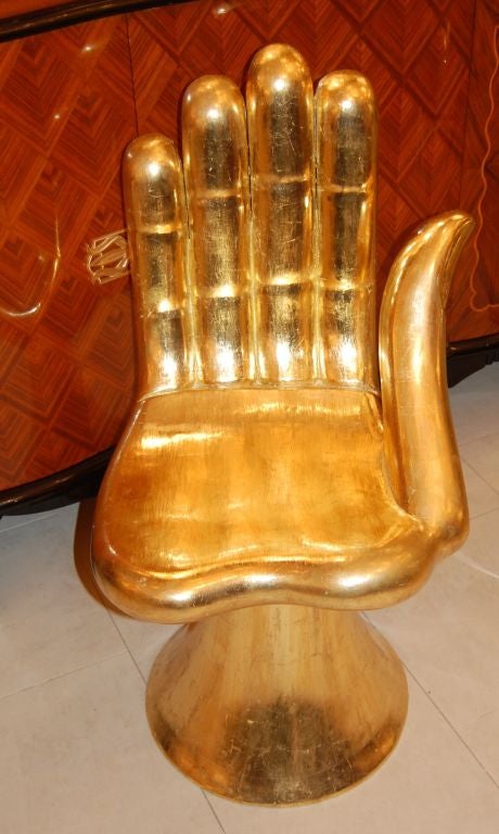 Signed Pedro Friedeberg gilt hand chair.

Seat Height: 16 Inches

Each chair is hand made to order by the artist, and is accompanied by signature and certificate of authenticity. 

The sculptor and painter Pedro Friedeberg works in a richly