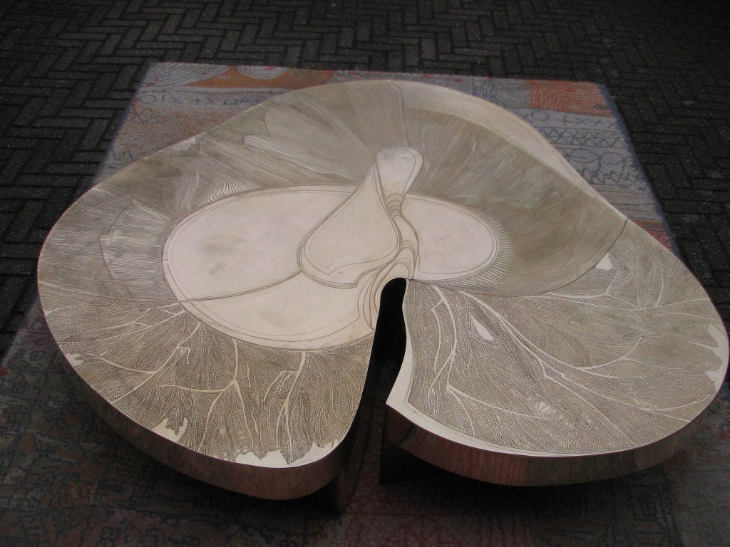 An outstanding etched bronze organic shaped coffee table, signed Atelier Armand Jonckers and dated 1979.