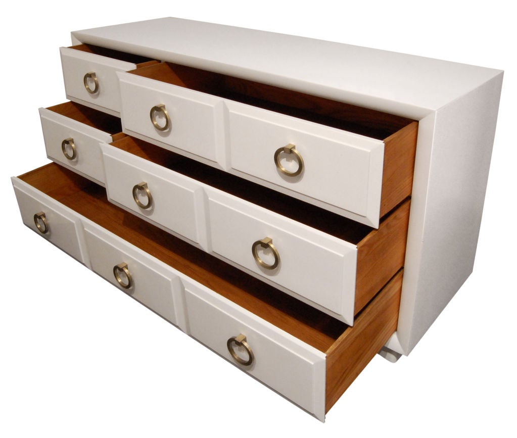 Chest of drawers No. 102 in white lacquer with brass pulls by T.H. Robsjohn-Gibbings for Widdicomb, American 1940's (Widdicomb label in drawer) <br />
This piece has five drawers