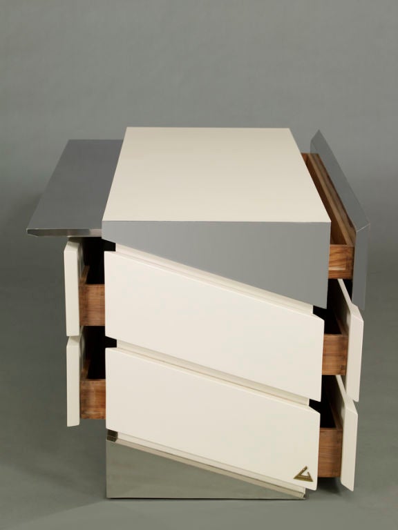 Amazing double-sided chest of drawers in white lacquered wood and chrome. Alternating drawers and one pull out shelf. Would make a great room divider or floating case piece. Signed on label.