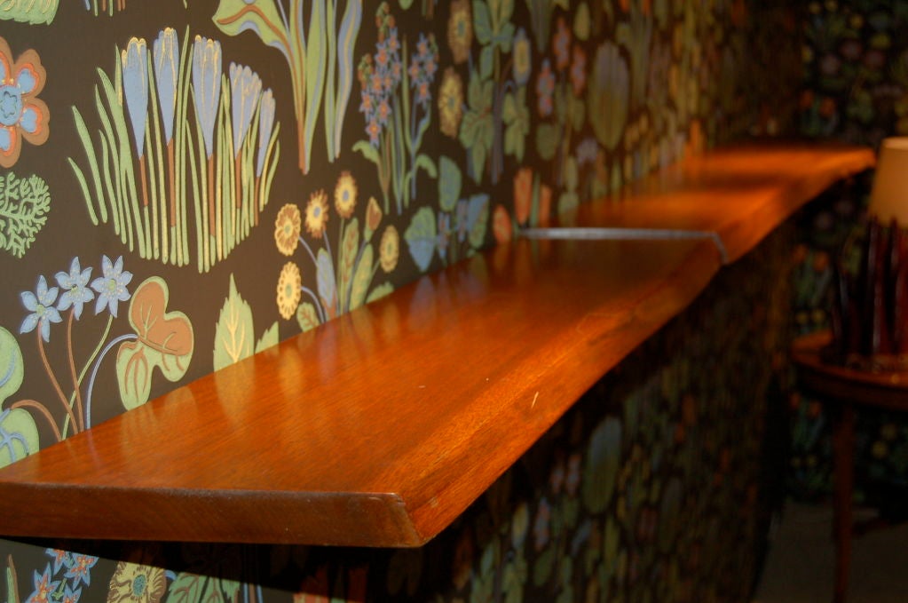 Shelf by George Nakashima with free form edge and tapered revael at one end.