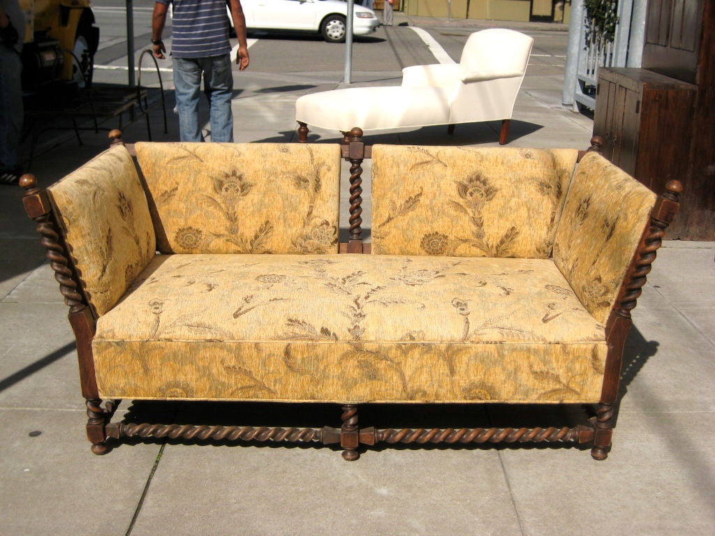 I've always been a fan of the classic Knole sofa. This reminded me of a primitive version with a barley twist twist.