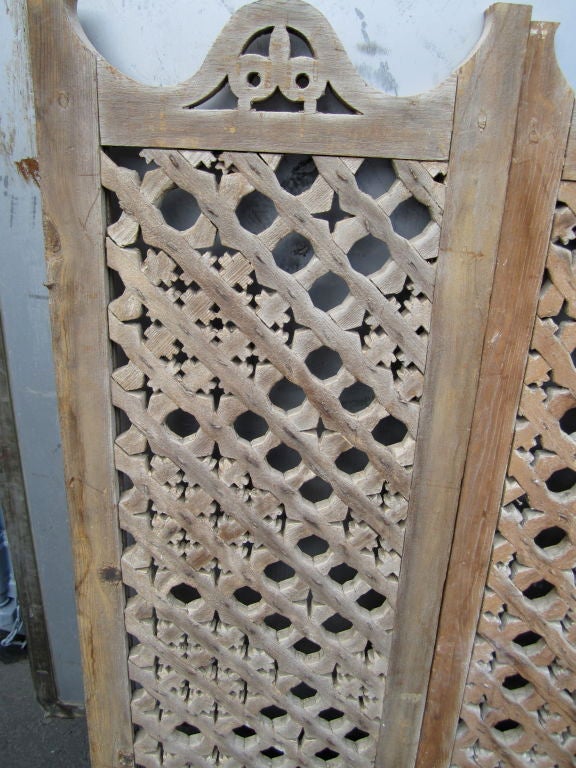 Masterfully carved set of five wooden panels. These dual purpose screens are integral in Islamic architecture serving to create domestic privacy and to cool and shade the interiors.