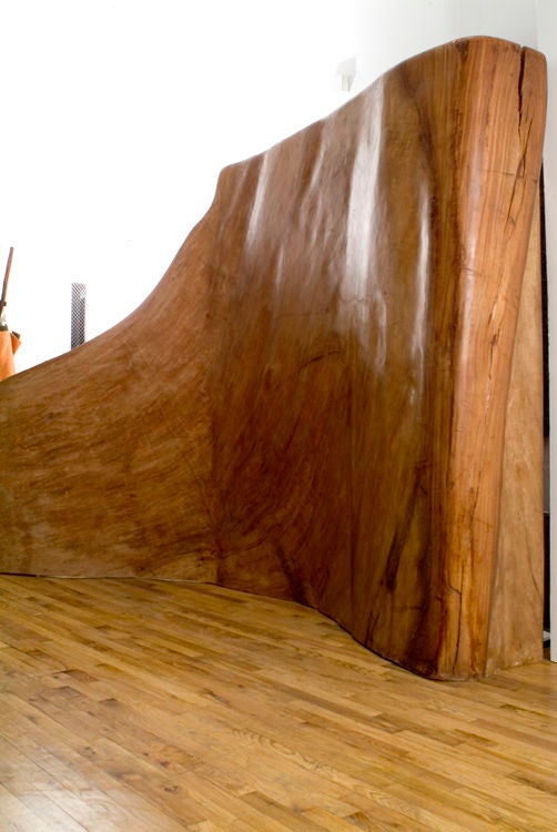 Enormously scaled and gently undulating banyan tree sculpture. One can't help but think of the magnificent work of Richard Serra when beholding this freestanding piece. The sky is positively the limit in terms of its application either as a room