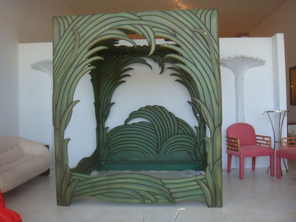 A Canopy bed attributed to Phyllis Morris. A most unusual piece of carved overscaled palm fronz intertwined to form this 