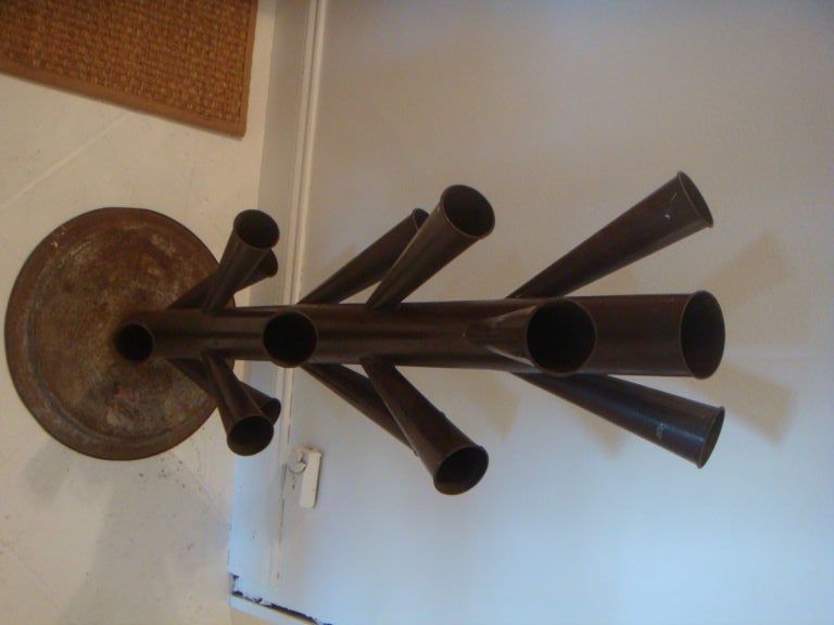 A most unusul pair of French tole epergnes. This pair is from a florist shop in the flower district of Paris. There is an old French label on the base of one. The pair is very sculptural and are a great size.