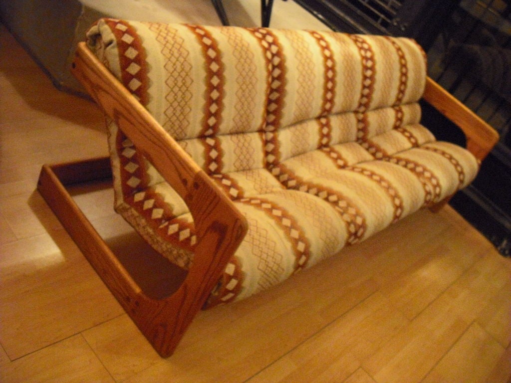 A great California designed wood block sofa by Lou Hodges. A comfortable sofa with a great sculptural lines.Matching pieces available.Signed.